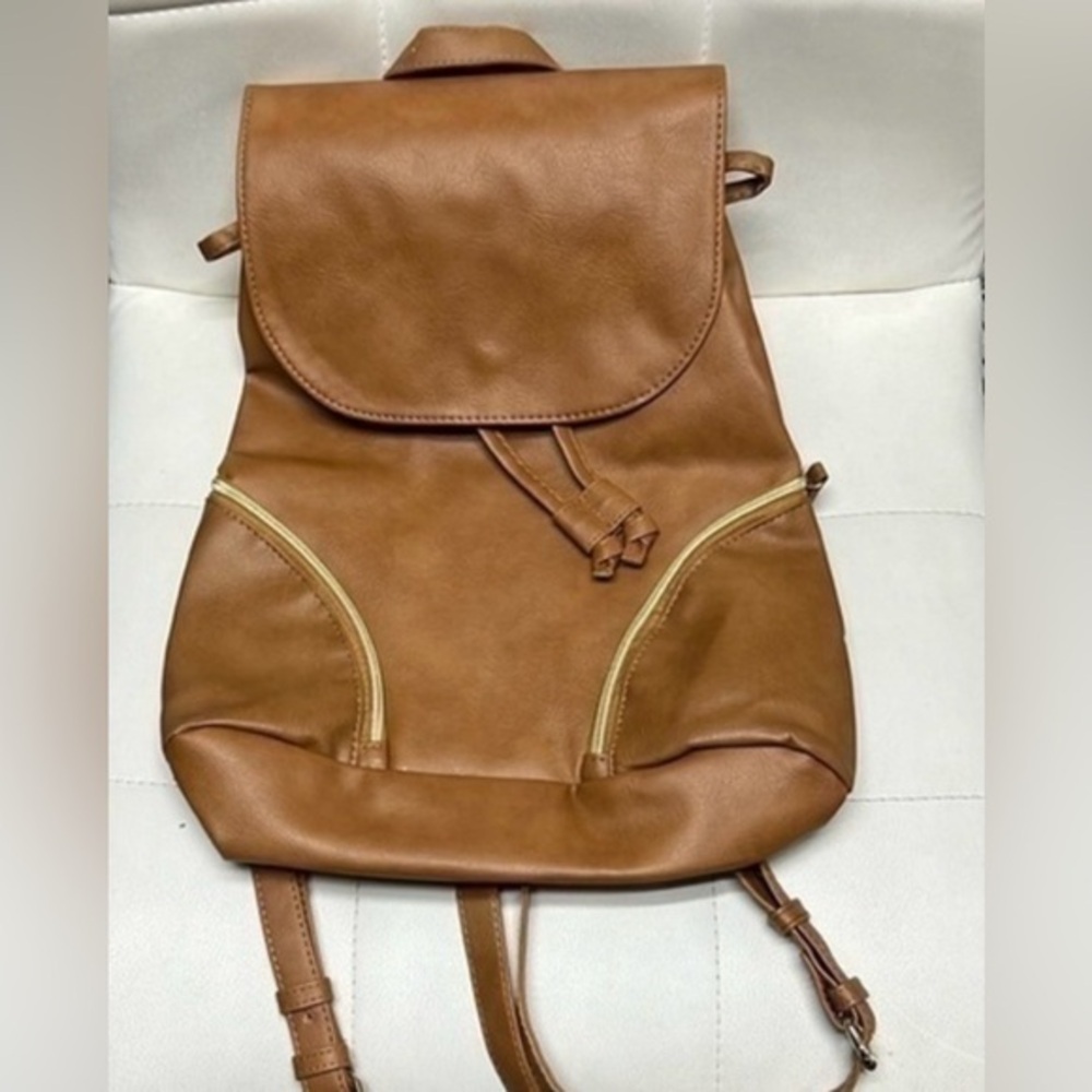 Brown backpack with zipper accented detailing on front, NWOT